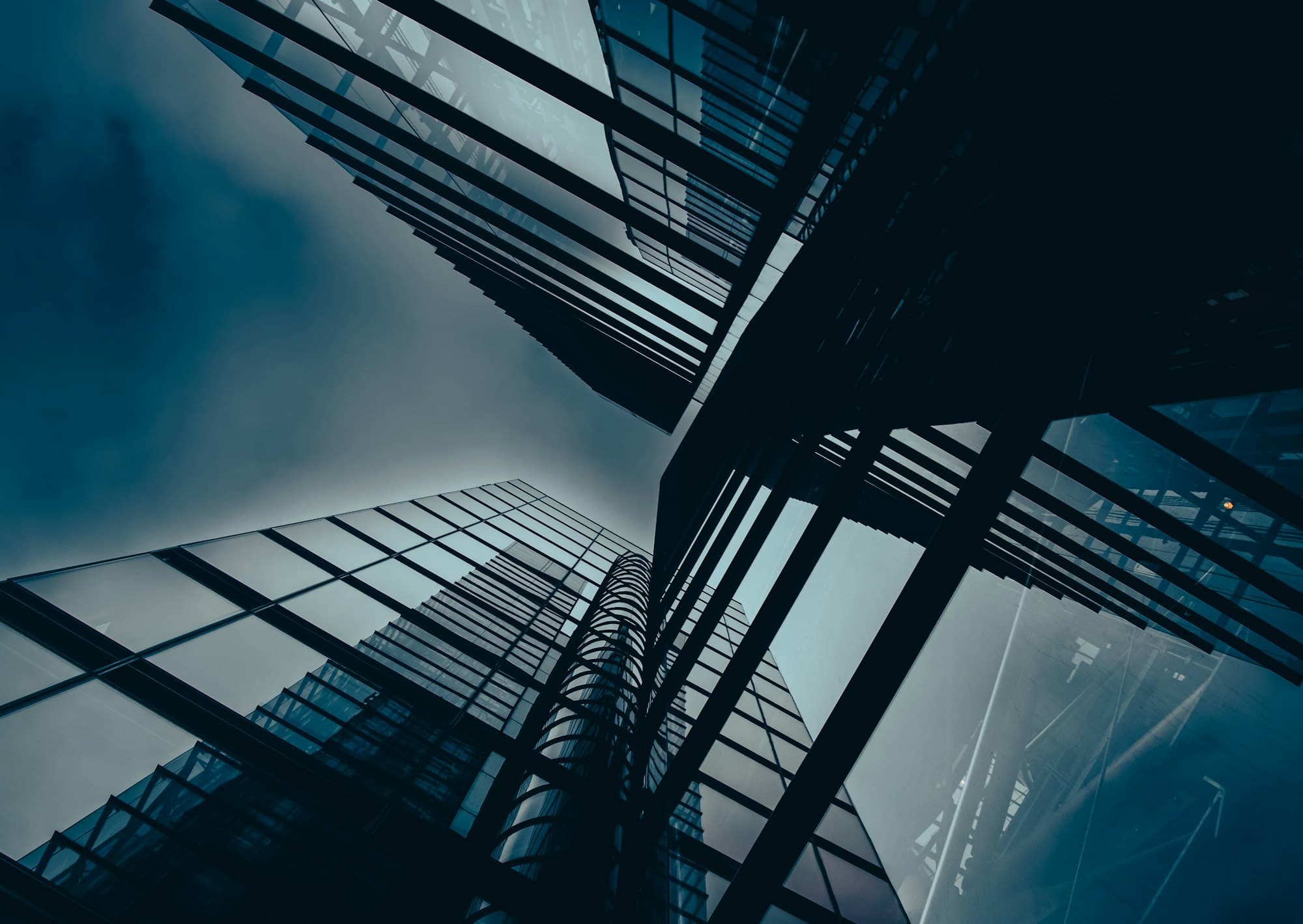 Glass office towers seen from street level