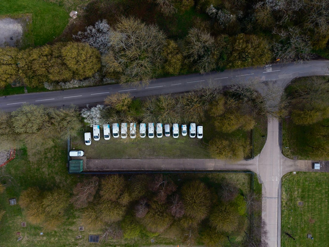 A delivery fleet parked in a row, seen from above