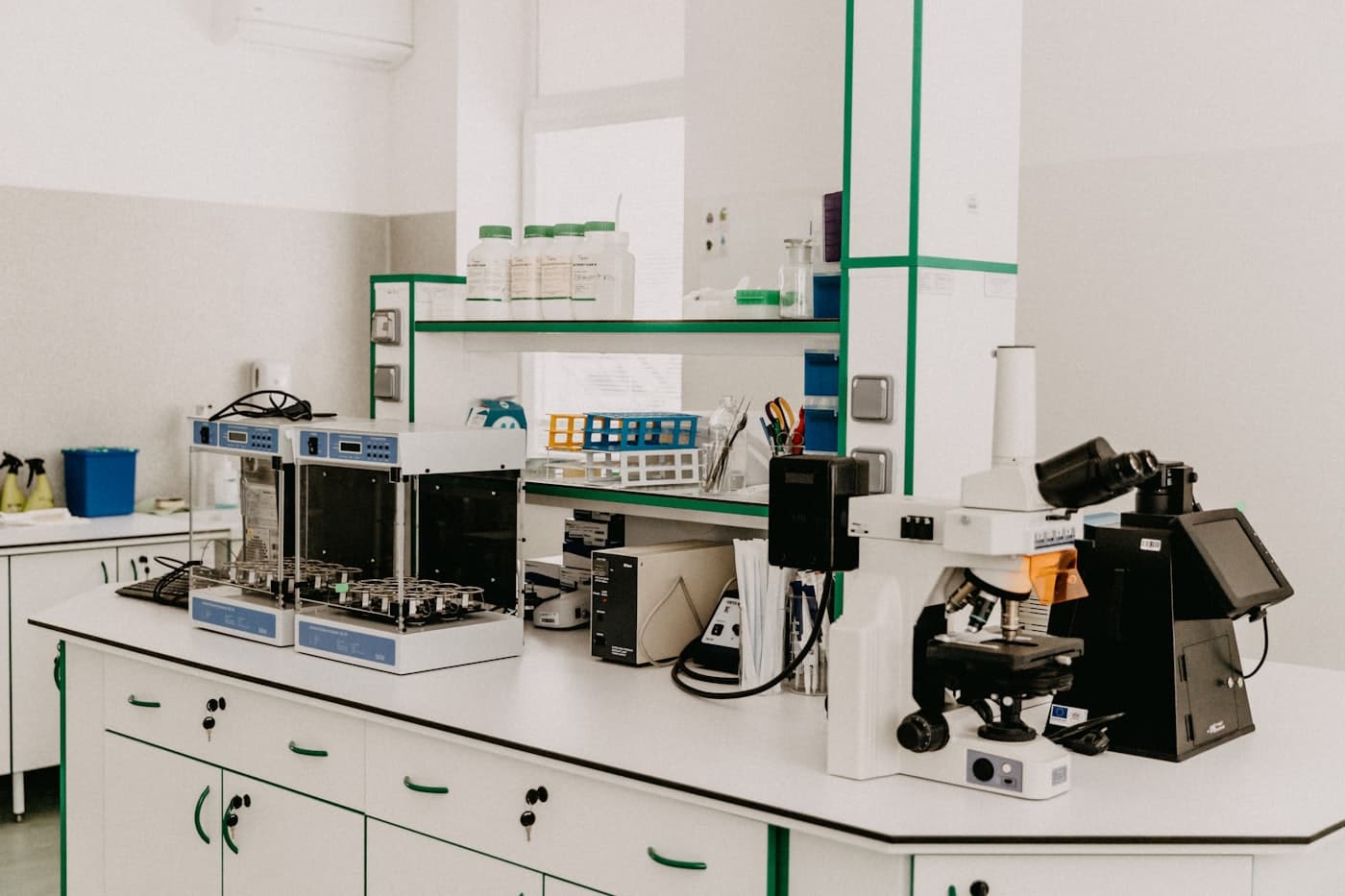 A laboratory bench with a microscope and instruments
