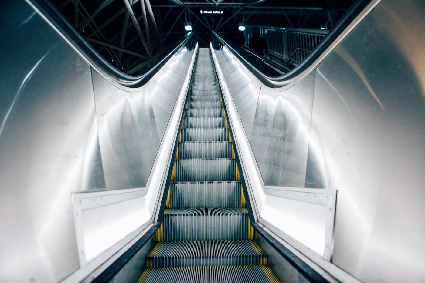 An escalator seen head-on in a transit hall